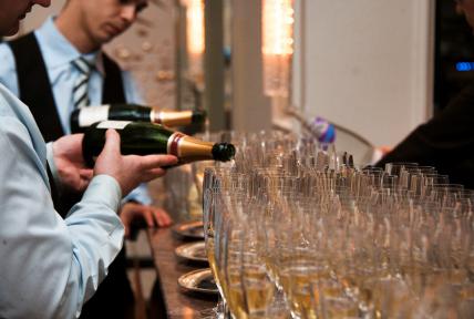 Champagne being poured into Glasses at Specialised Chef Graduation