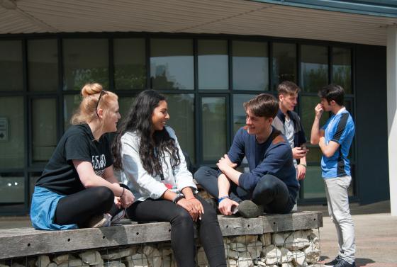 Students sat outside talking 