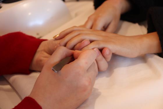 Nail filing in beauty salon