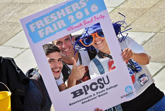 Students with selfie frame at Bournemouth & Poole College