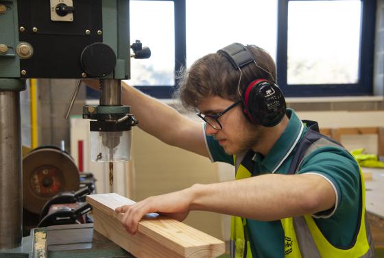 Student using woodwork machine